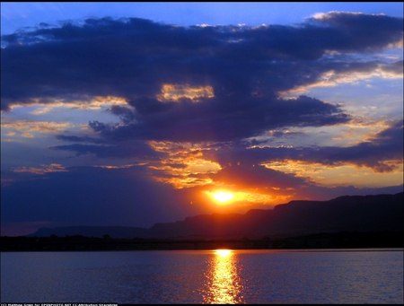 Mountain Sunset - beauty, lake, sky, popular, places, water, mountains, gold, nature, clouds, sunsets, colors