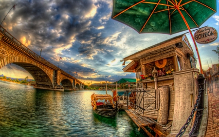 Simply Beautiful - boat, flowers, umbrella, sky, clouds, water, beautiful, beauty, colors, gondola, lovely, architecture, pier, boats, colorful, river, nature, peaceful, bridge