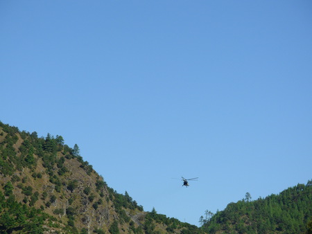 Halicaptor flying between hills - flying, halicopter, pictureque, hills