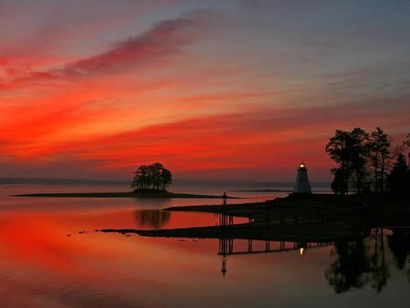 The Time Of Dusk - lighthouse, sky, trees, beacon, serene, peaceful, water, sunset, nature, tranquility, glowing, evening, red, beautiful, sea, quite