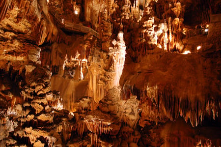 Grottes (cave) des Demoiselle, France - white, cave, figure of mary, brown, fence, stalactites