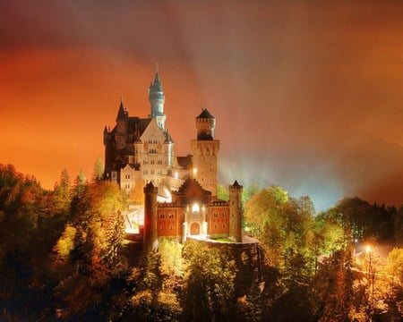 Neuschwanstein at night - trees, castle, illumination, light rays, orange