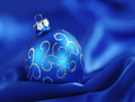 Blue christmas ball on silk cloth