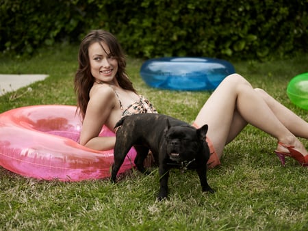 Olivia Wilde Guardian - woman, beauty, people, black, model, beast, dog, green, olivia wilde, grass, garden, protector, sexy, actress, girl, summer, blue, beautiful, pink, animal