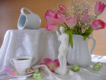 Still Life - pretty, pink, flowers, statue, vase, beautiful, coffee, pink tulips, photography, chocolate, beauty, colors, lovely, still life, petals, tulip, white, tulips, nature, cup of coffee, cup