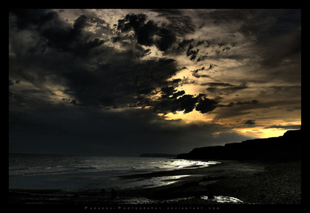 The Isle of Wight UK - clouds, yellow, coast, sea, stones, black, silhoutte, sky, rocks