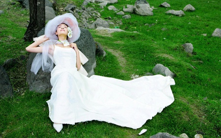 Happiness - woman, lilies, lush, veil, hat, female, bride, ground, gown, bridal, pure, rocks, white, pretty, green