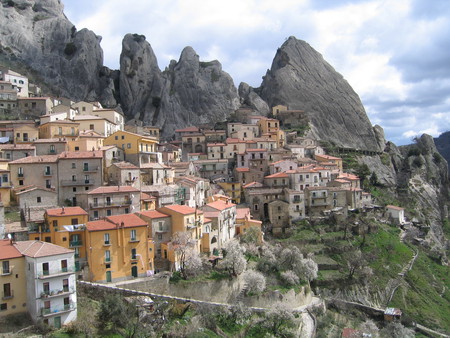 Castel Mezzano, Italy - sky, rocks, vegetation, houses, clouds, village