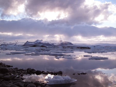 Icelandic Landscape - water, refelction, stones, clouds