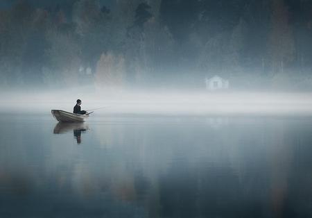 THE COUNTRY OF A THOUSAND LAKES - calmness, still, water, fisherman, boat, mist, lake, forest