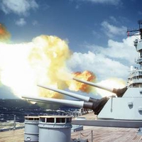 USS Iowa firing a broadside