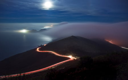 Nightmoves - hill, moon, water, fog, evening, road, foggy, night, ocean, mountain, glow, lights