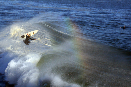 Surfer in the Air - water, rainbow, blue, surfing, waves, surfer