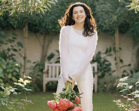 Julianna Margulis - nice, actress, female, long curly hair, smile, white dress, flowers