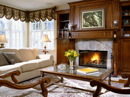 room with a fireplace - 2 chears, small table, elegant, beautiful, books, big window, sitting place, fireplace, fire, painting, 2 lamps, flowers vase, living room