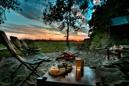 Footsteps - tent, footsteps, camping, bush camp, picnic, sunset, camping chairs, africa, fire, nature, botswana, lanterns, beer, dusk, okavango, cheese