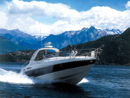 Boat and Mountains - speed, clouds, water, blue, boat, mountains, wave, sky