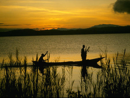 fishing at the lake at sunset - sky, lake, boat, fishing, sunset, grass