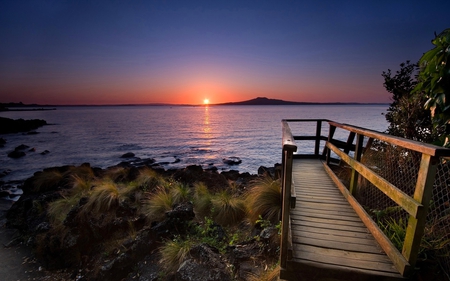 ENCHANTING SUNSET BEACH - sunset, water, beach, railings, rocks, sun