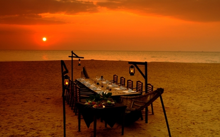 Simply Beautiful - romantic, beach, evening, chairs, romance, lamp, sand, dinner, sky, lamps, sun, clouds, beautiful, sea, table, beauty, lovely, ocean, nature, sunset, lights, peaceful