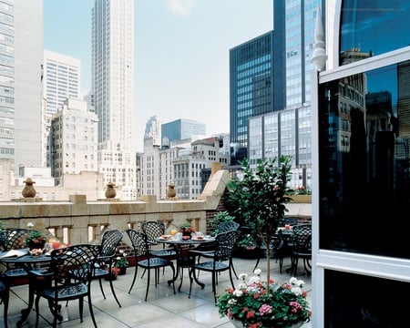 City Hotel Balcony - tables, view, balcony, city, chairs, hotel, flowers, skyscrapers