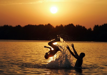 Water Fun - silhouettes, fun, swimming, golden, splashing, sunset, playing