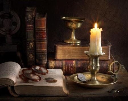 wisdom - coins, glasses, lights, candle, books, still life