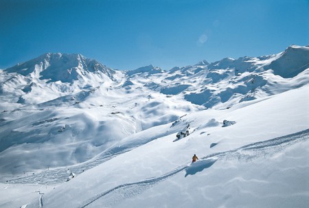 Snowy Mountains - white, person, immense, blue, snow, skiing, mountains, sky