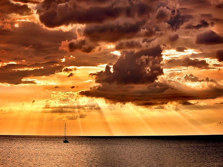 Sailing - boat, beautiful, amazing, ocean, view, golden, nature, sunset, sailboat, rays, beauty, sailboats, peaceful, sky, sunlight, clouds, lovely, sailing, sea, boats