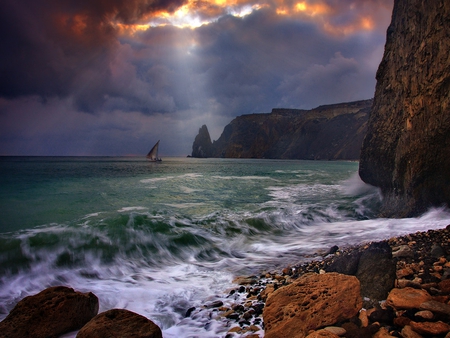 Sailing - boat, splendor, sailboats, sailing, view, sky, storm, clouds, sunlight, beautiful, sea, beauty, colors, lovely, ocean, stones, boats, colorful, nature, sunset, rays, sailboat, waves, rocks