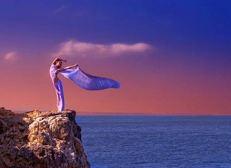 Cliff breezes - woman, ocean, evening, cliff, blue dress, wind blown