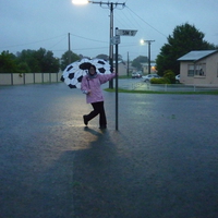 Daughter enjoying the rain