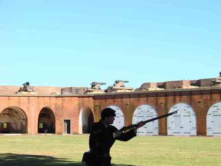 The ammo dump - guard, soldier, arches, cannons, shadow, sky