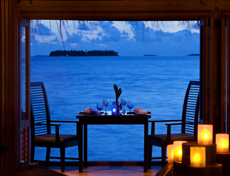 Romantic Dinner - clouds, pretty, house, blue, romantic, evening, chairs, room, table, sea, resort, lovely, dinner, view, candles, sky