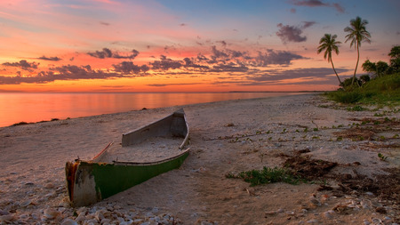 Abandoned Boat - sundown, sunrise, abandoned, sand, place, paradise, beauty, colors, boats, tropical, nature, sunset, green, beach, boat, grass, shore, red, old, view, sky, clouds, palms, trees, beautiful, sea, orange, lovely, ocean, tropics, colorful, glow, sands, peaceful