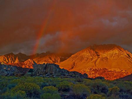 The Rainbow - greens, sunset, grey rocks, rainbow, beautiful, red sky, mountains