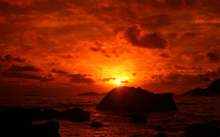 Red Sunset - beauty, sky, peaceful, sun, sunset, rocks, view, amazing, clouds, red sunset, rays, ocean, sunlight, lovely, nature, beautiful, red, sea