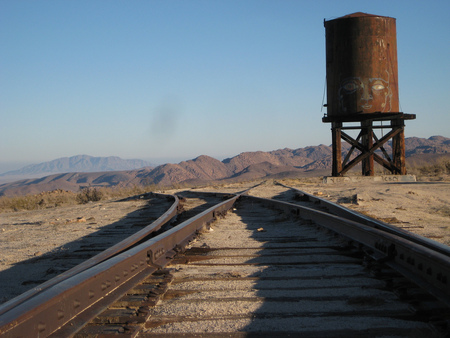 Ride the rails - train, tracks, feild, watertower, mountain