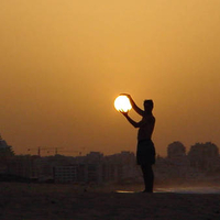 Brilliant sun captured in hands