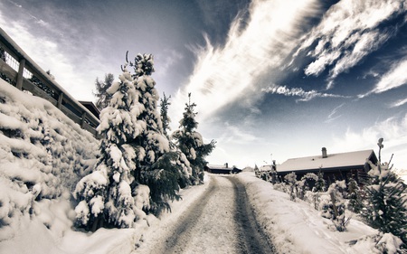 A road in Switzerland - trees, winter, blue, beautiful, road, skies, nature, cloud, mountains, houses, rural, formations