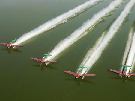 Not flying...water skiing! - airplanes, ski, water, flying, sea, photograph, planes, aicraft, skiing