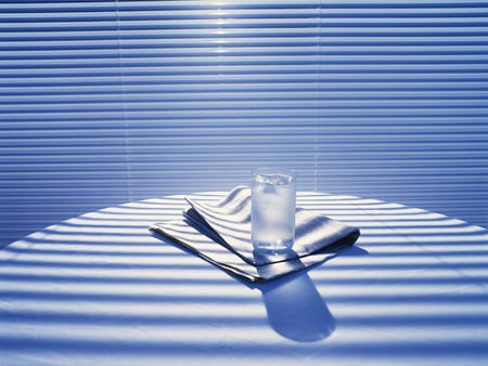 A glass on the table - lights and shadows, newspaper, photography, table, shadows, interior, glass