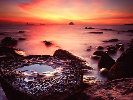 Rocks at Sunset - water, yellow, colour, evening, sea, ocean, orange, rockpools, dusk, sky, rocks