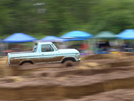 Motion - tent, people, truck, dirt, other