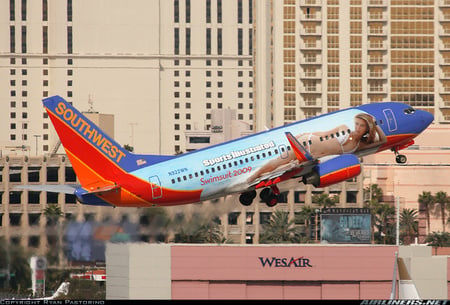 Southwest-swimsuit edition - city, jet, building, airline