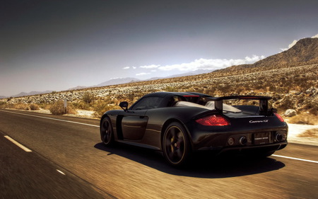 Porsche Carrera GT - fast, porsche carrera gt, black, road, 1080p, exotic, cool, car, speed, skyline, desert, 1080i