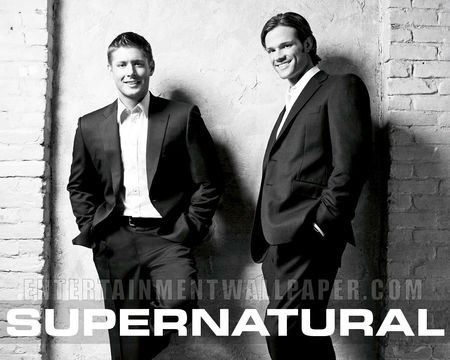 Supernatural Demon Hunters - suit and ties, black and white photo, looking sharp, brickwall background