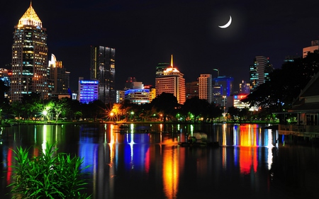 Bangkok - colorful, view, modern, reflection, grass, boat, lake, building, boats, park, buildings, skyscrapers, nature, skyline, beautiful, leaves, beauty, sky, trees, bangkok, peaceful, water, architecture, green, house, moon, houses, night, lovely, thailand, city, colors, lights