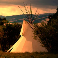 A photo of a Plains Indian teepee at sunrise