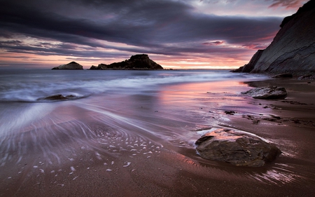 Purple Sunset - beach, reflection, sand, purple sunset, purple, view, sky, clouds, beautiful, sea, beauty, colors, lovely, ocean, nature, sunset, waves, peaceful, rocks